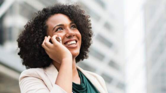 Woman with curly hair on phone